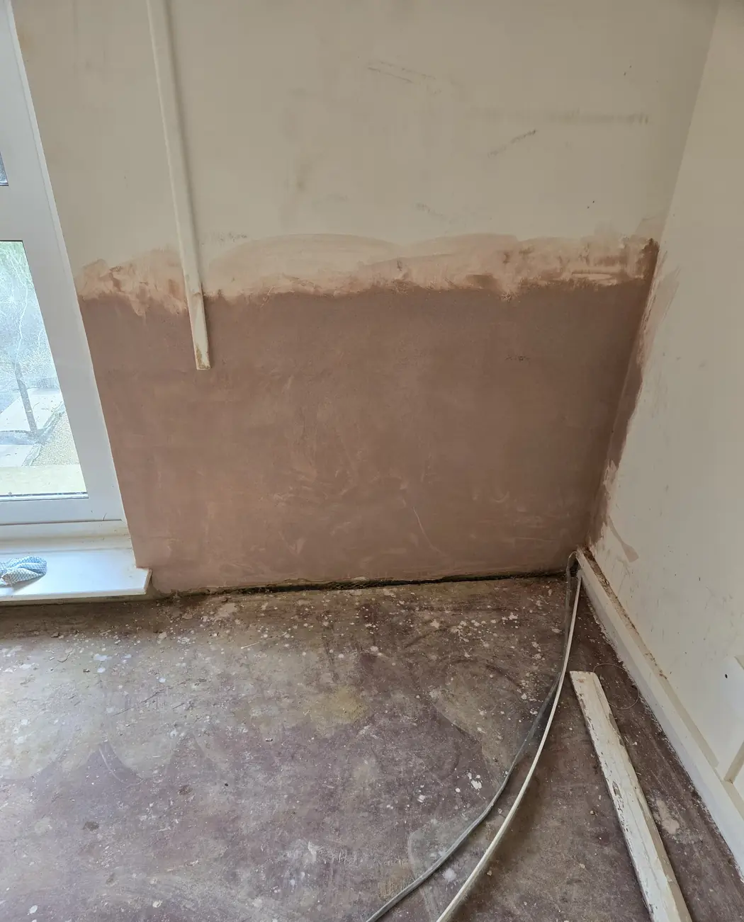Finished, painted room with the repair blended into the wall